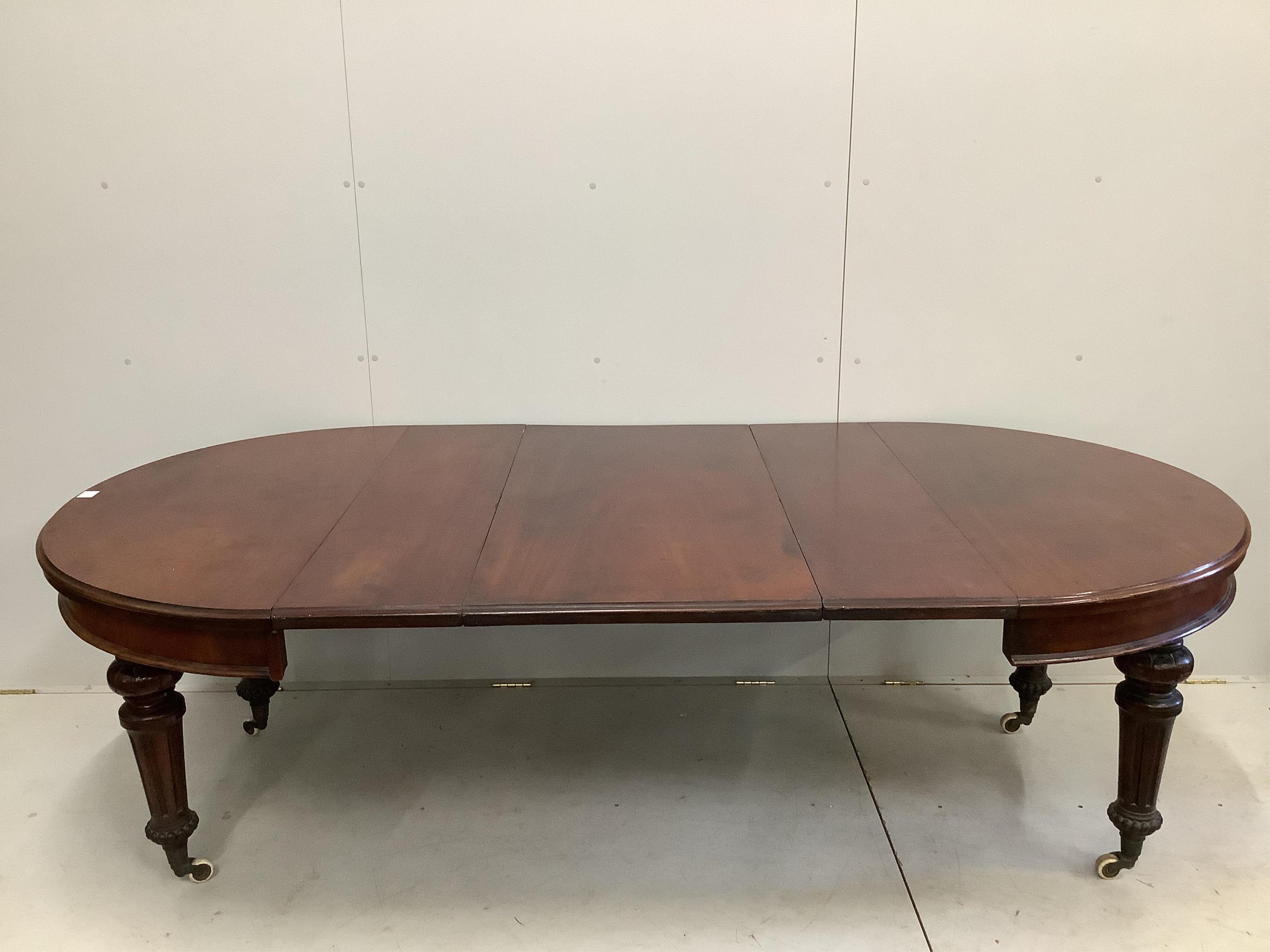 A late Victorian mahogany extending dining table, 240cm extended, three spare leaves, depth 120cm, height 73cm